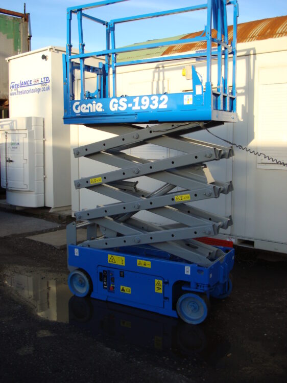 Blue Genie scissor lift in the elevated position for sale
